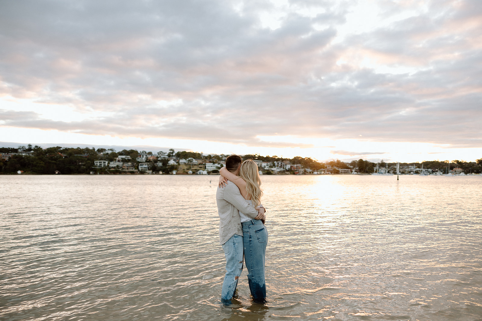 couple hugged at their beach pre wedding session