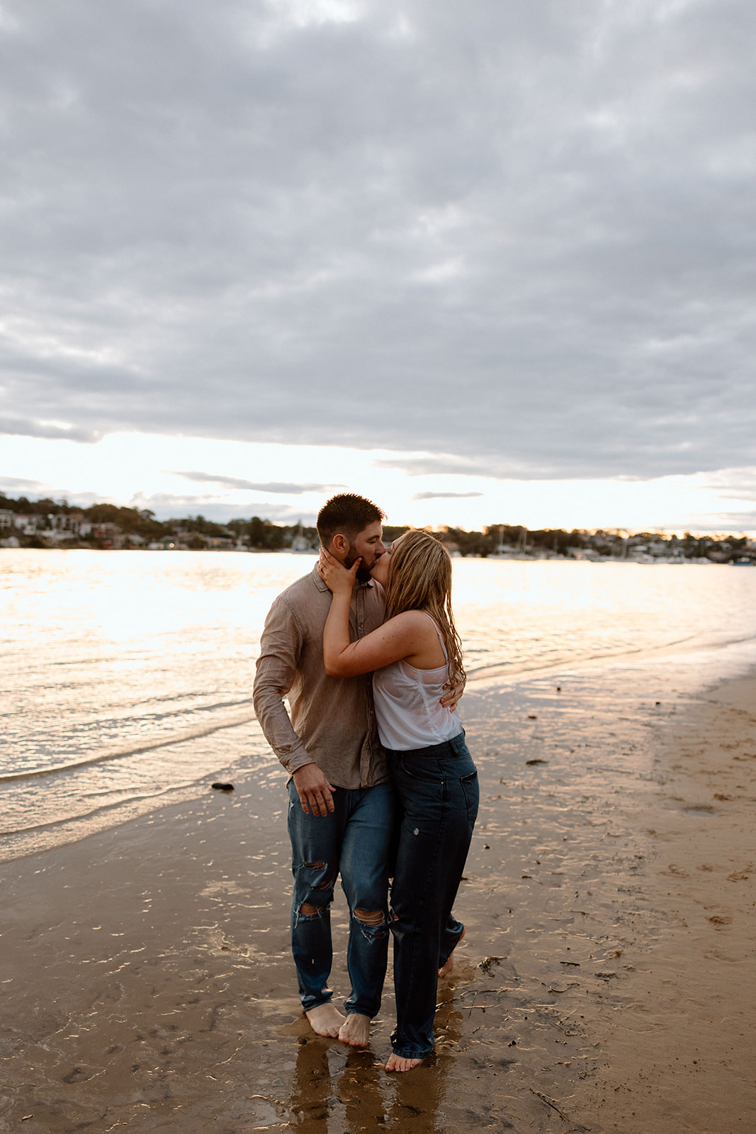 couple playing at the beach during their pre wedding session