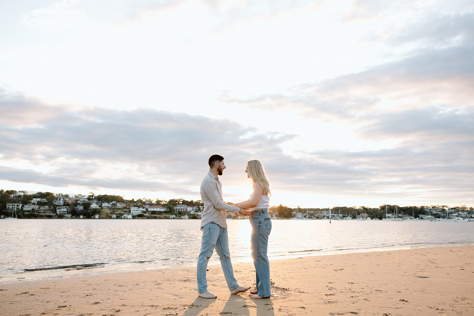 Couple under sunset in beach pre wedding session