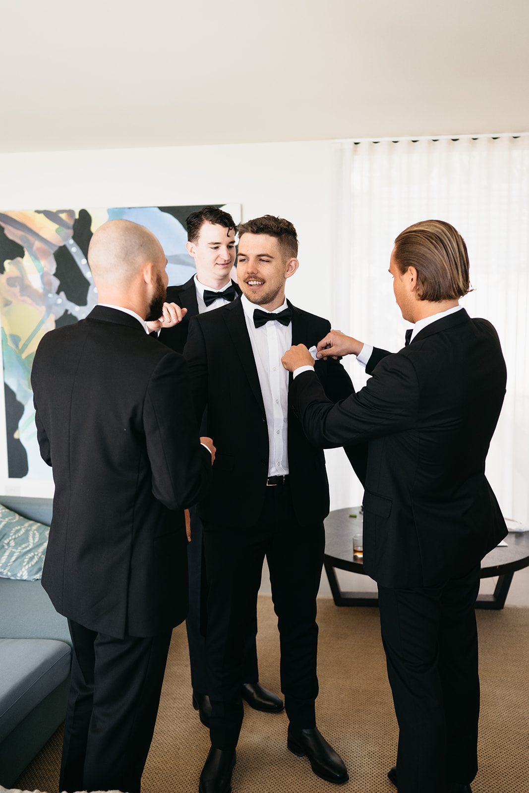 candid photo of groom and groomsmen