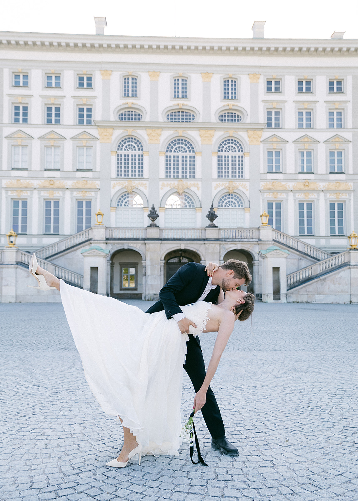 Bride and groom dance in front of Schloss Nymphenburg
