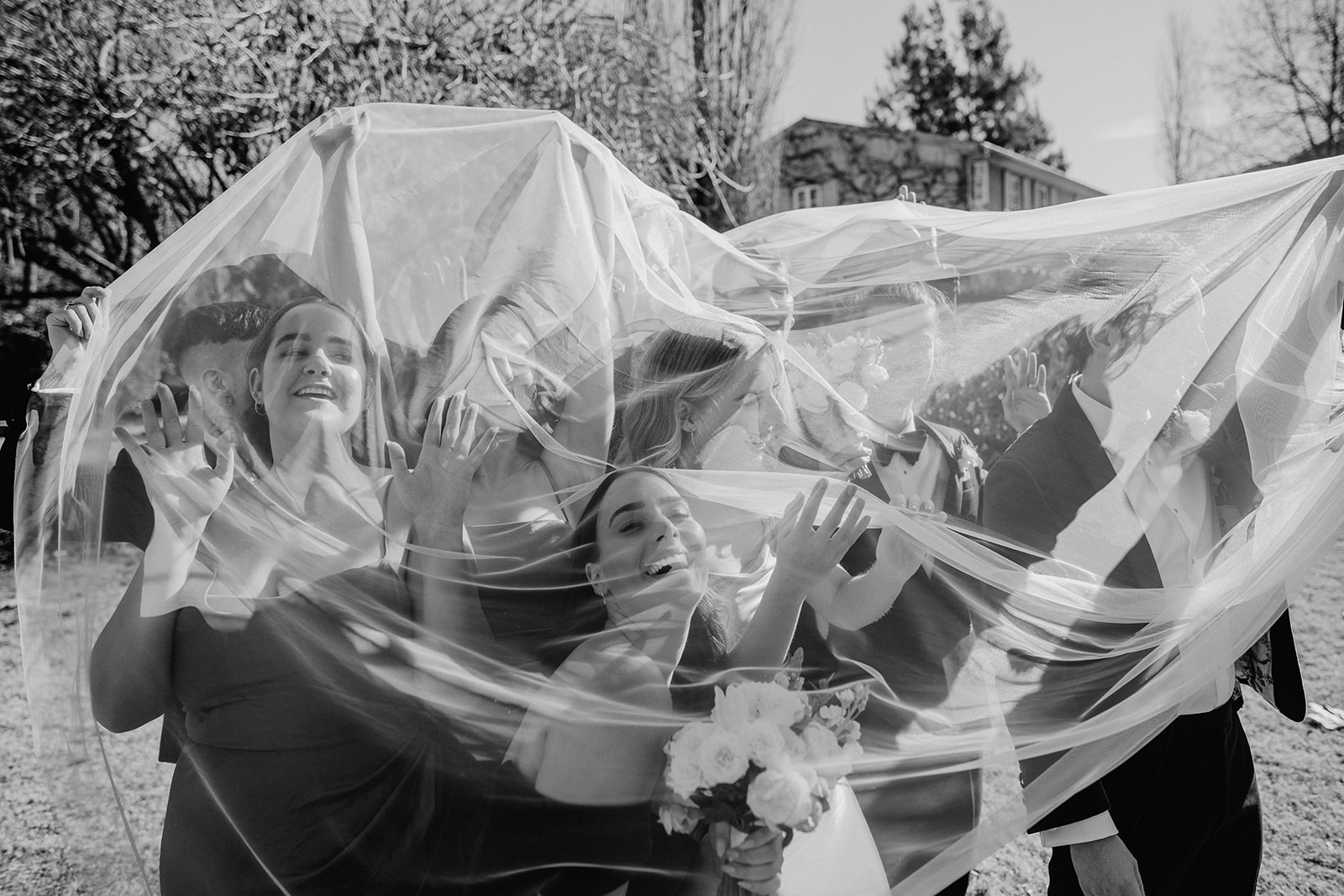 bridal party under veil at Redleaf wedding 