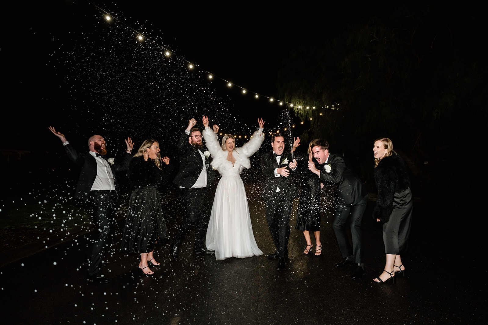Night time wedding photography at brown brothers Milawa. champagne spray wedding photo