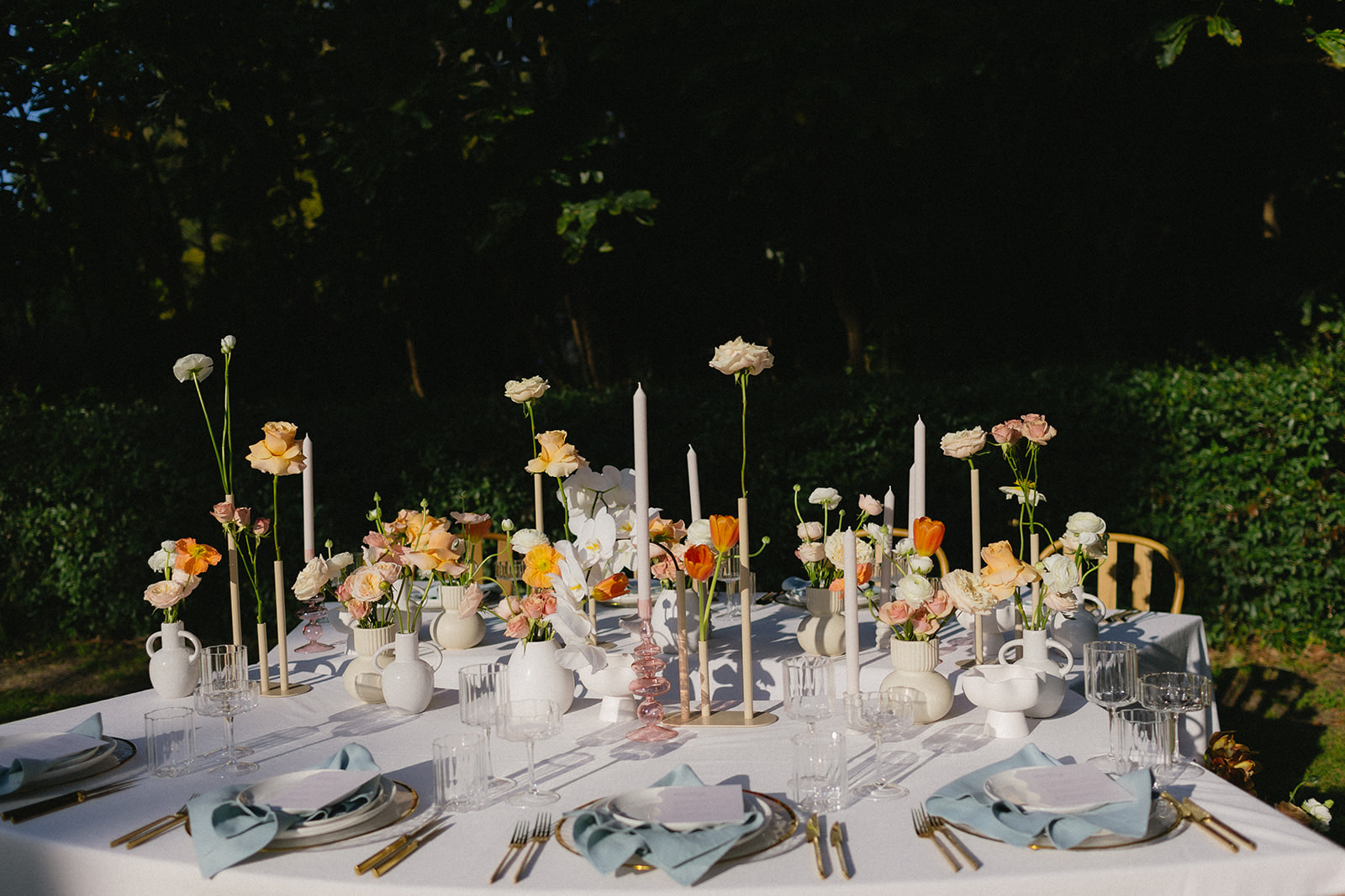 An intimate spring garden wedding with delicate florals and pastels with whimsical light