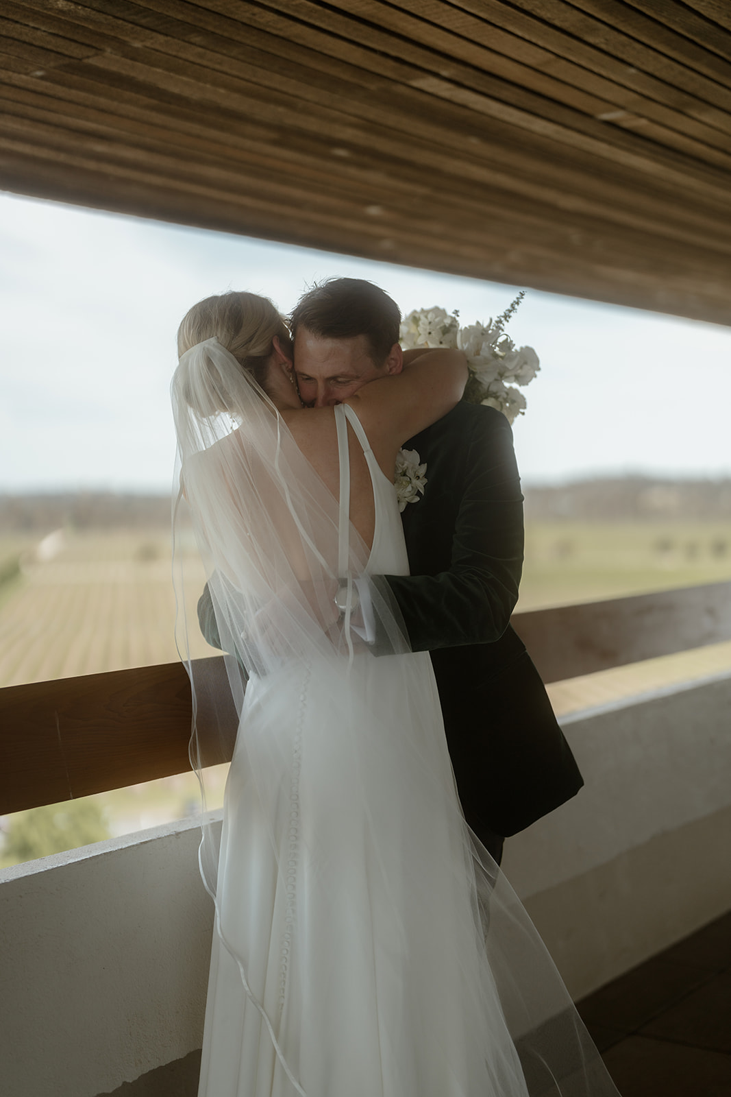 Zoe and Nathan sharing an emotional hug during there first look at Mitchelton winery wedding venue