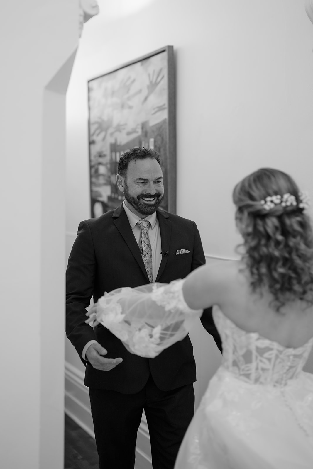 Bride in elegant wedding gown shares emotional moment with father before Montsalvat ceremony.