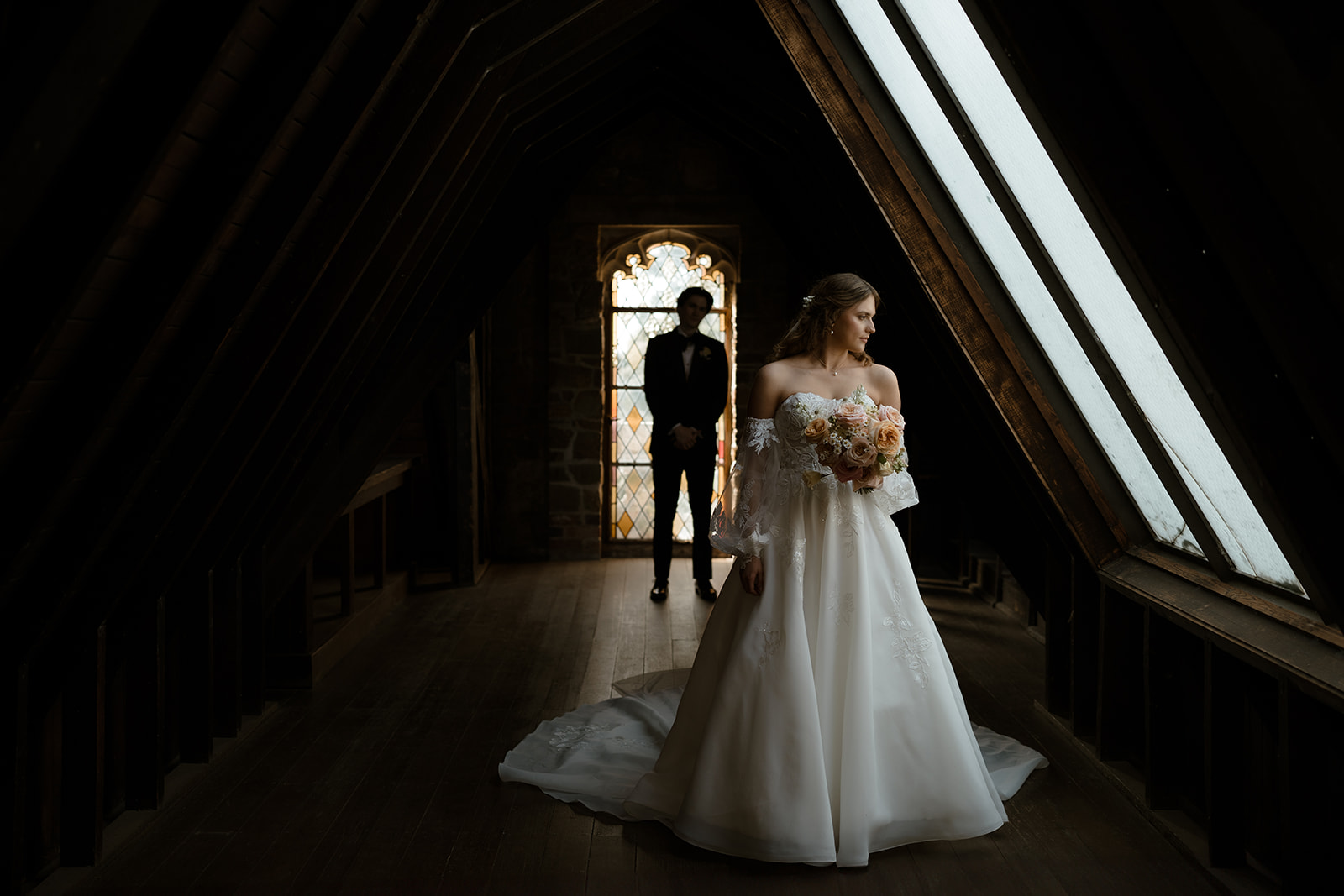 Bride in stunning gown bathed in soft light at Montsalvat, Australia