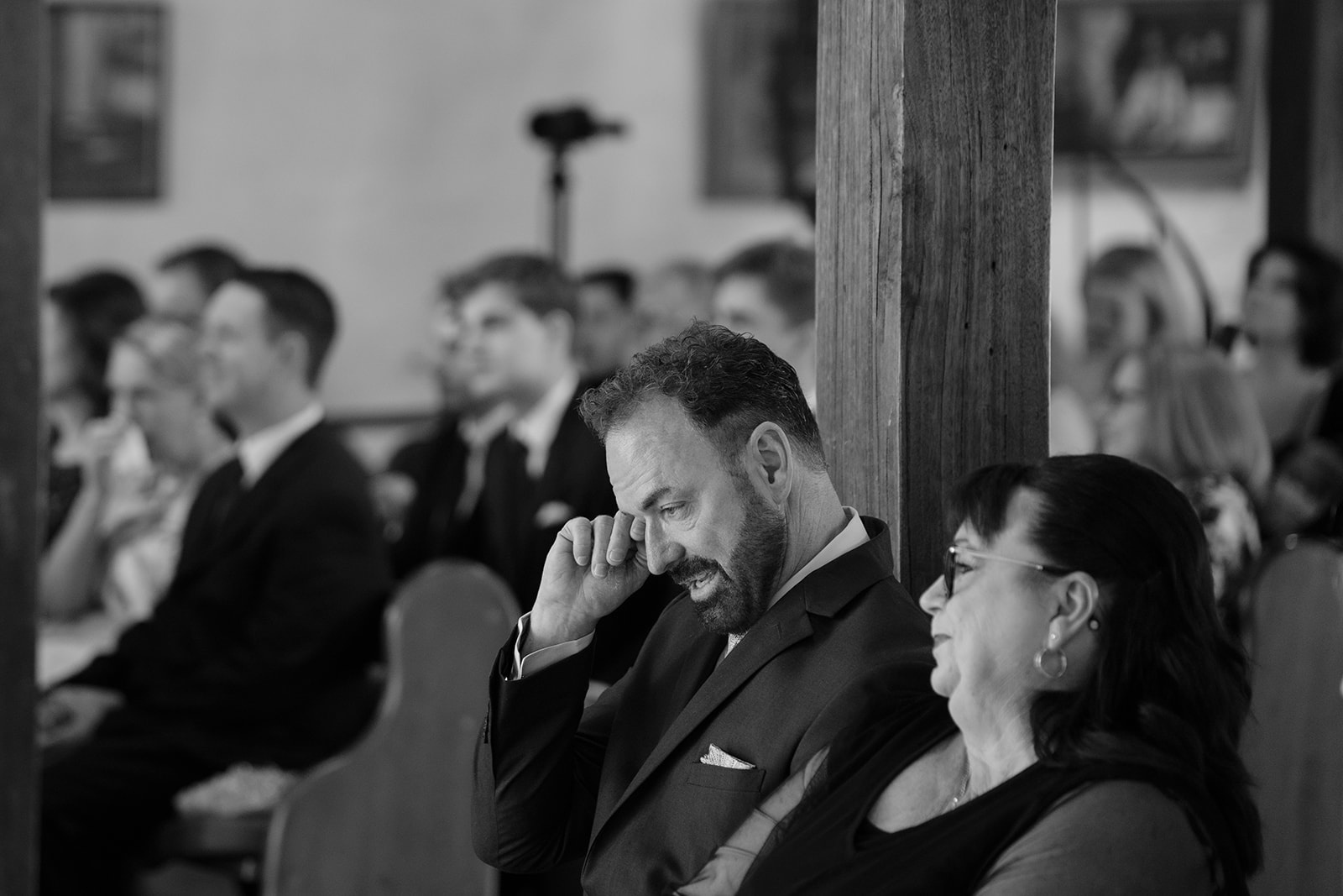 Father's touching reaction to daughter's vows as he wipes tears away.