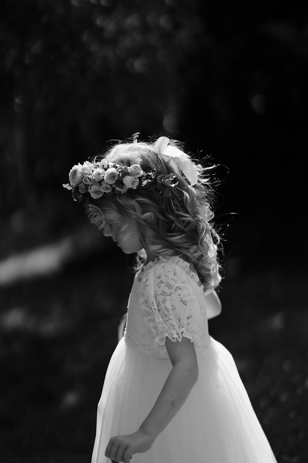 Flower girl proudly displaying her handmade flower crown at Montsalvat