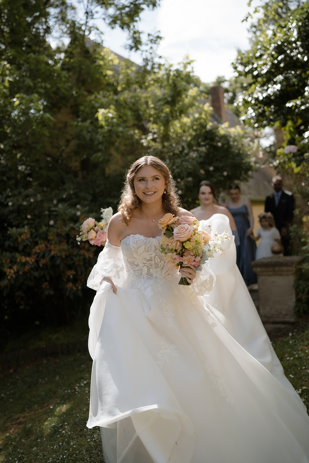 Montsalvat's iconic backdrop frames a bride's walk to her wedding ceremony.