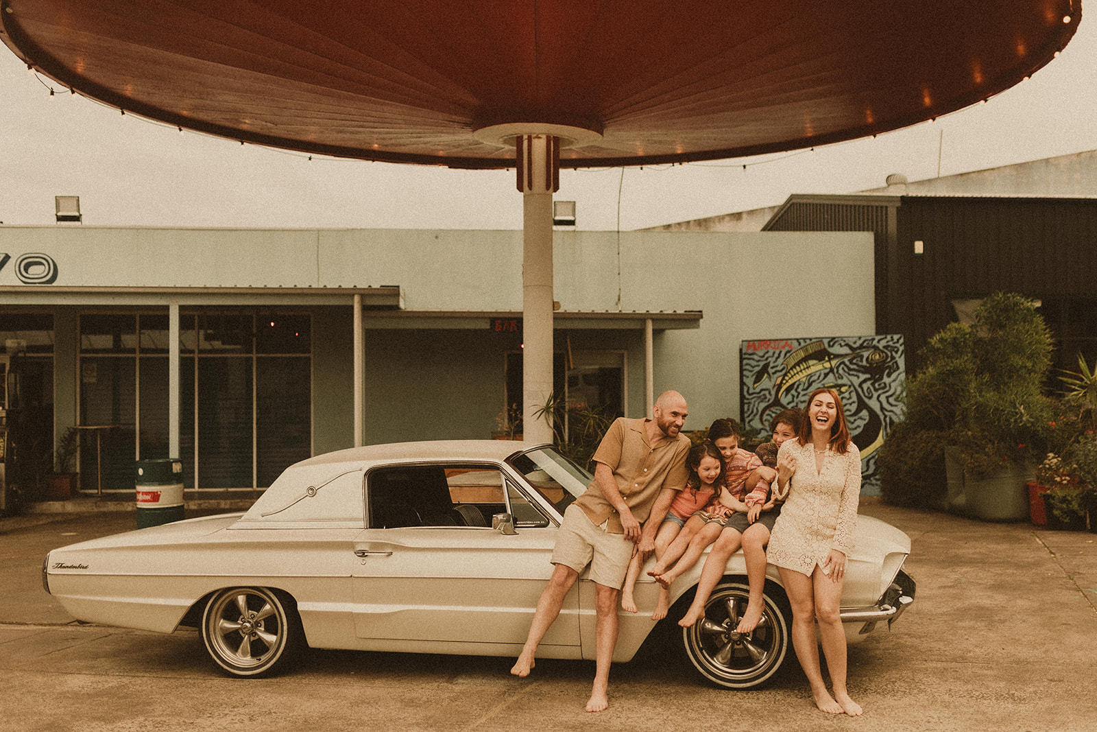 A family who had a fun family shoot in a retro servo on NSW South Coast.