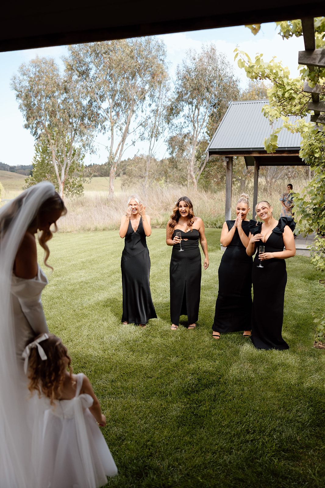 Bride first look with her bridesmaids at the wedding in the Southern Highlands Bendooley Estate