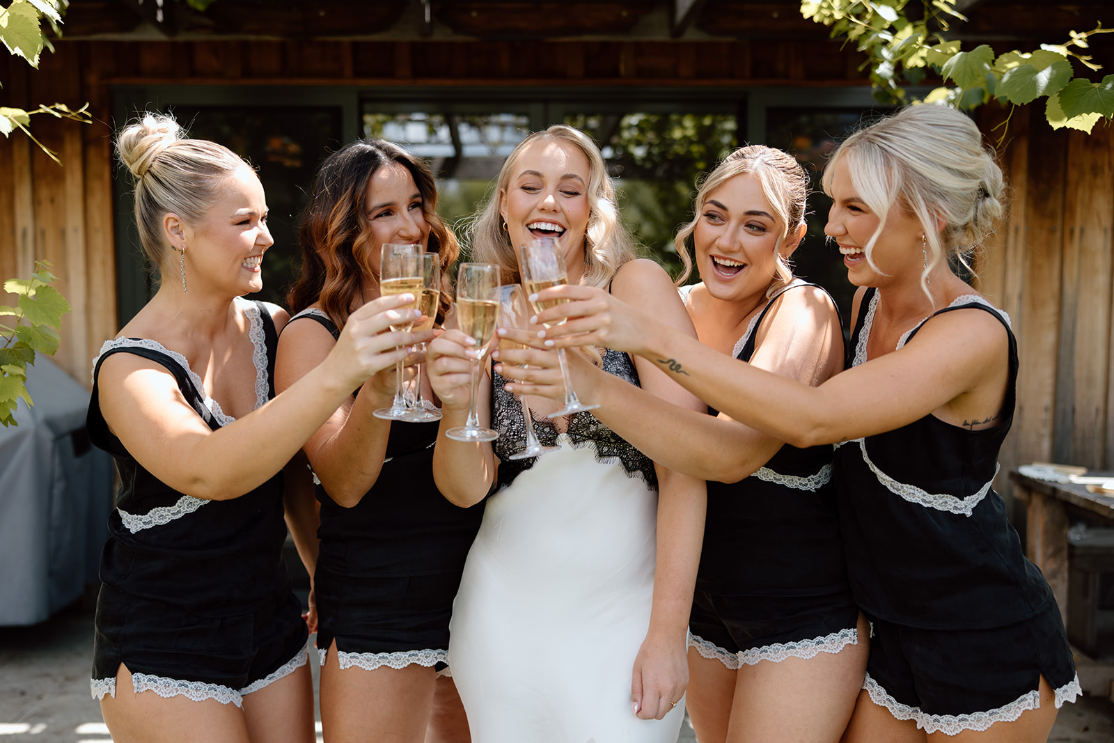 Bride with her bridesmaids having champagne at the wedding in the Southern Highlands Bendooley Estate