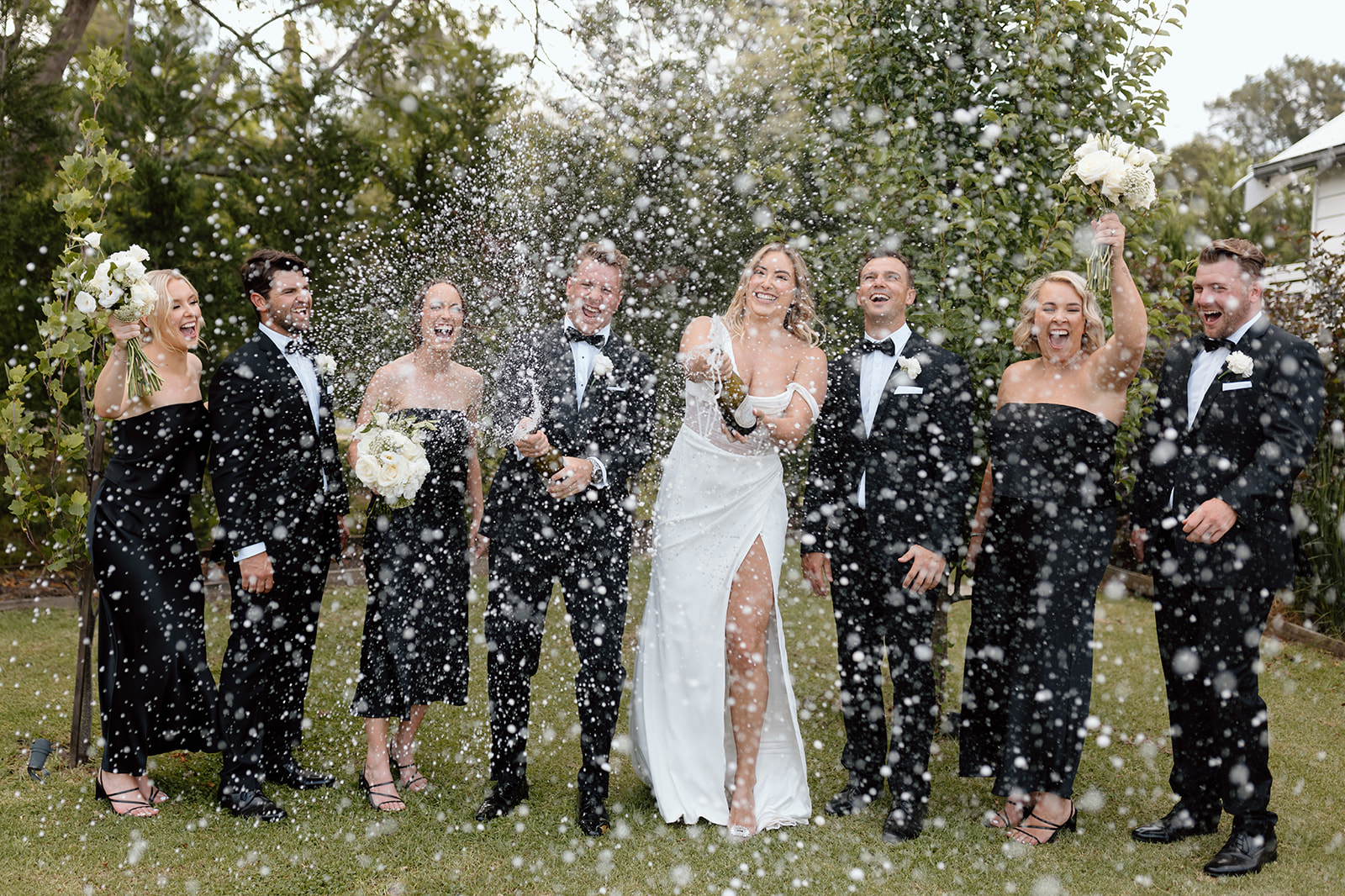Couple with their bridal party during champagne shower at the wedding in the South Coast The Homestead Berry