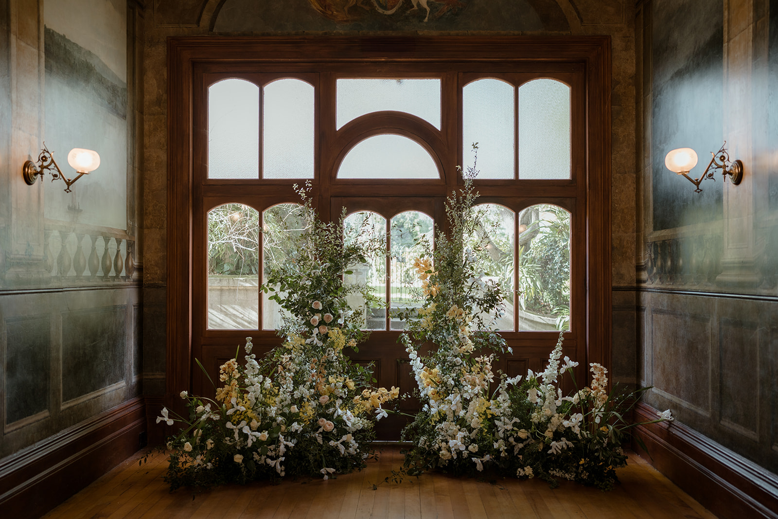 Luxury Wedding Ceremony at Villa Alba Museum with Pastal Floral Arrangements and Curved Windows