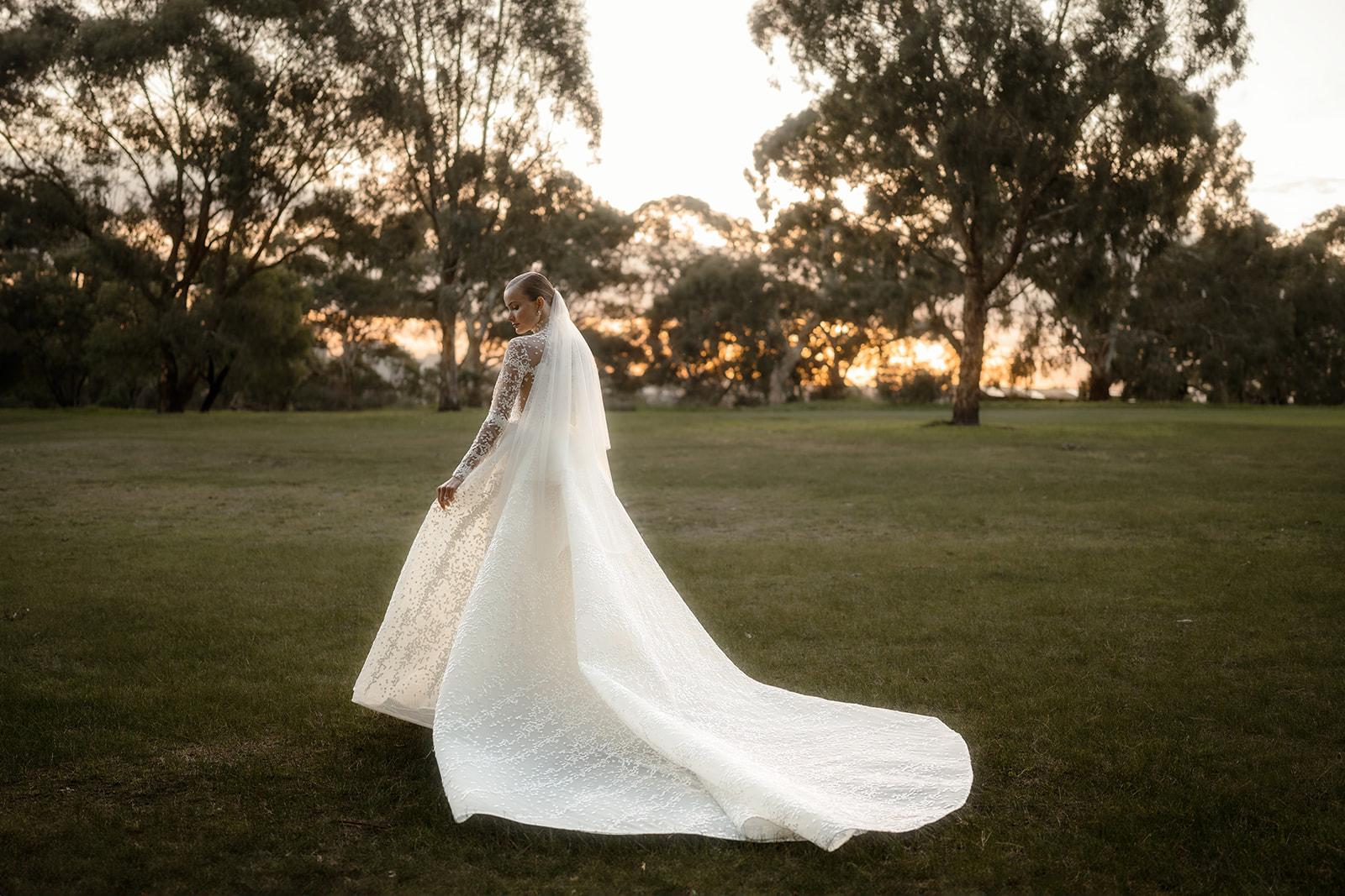 Melbourne Bride in Wedding Gown Poses at Studley Park Grounds