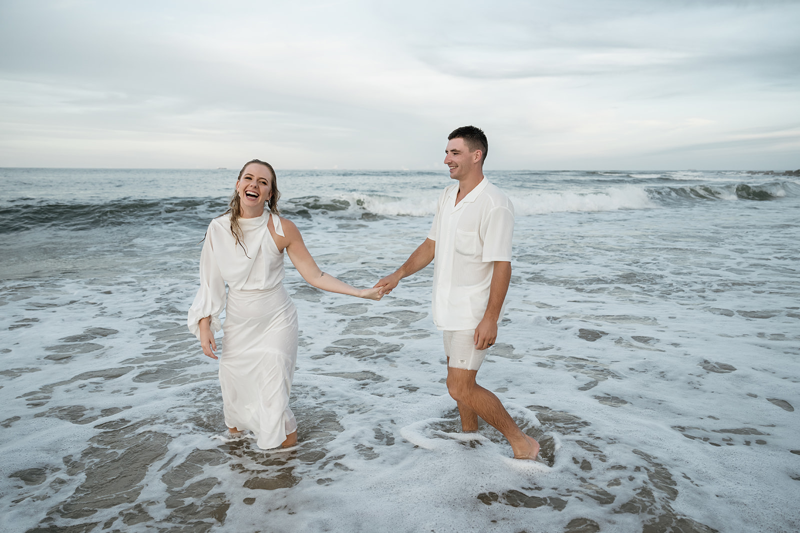 Couple jumps in the ocean after eloping on the Sunshine Coast 
