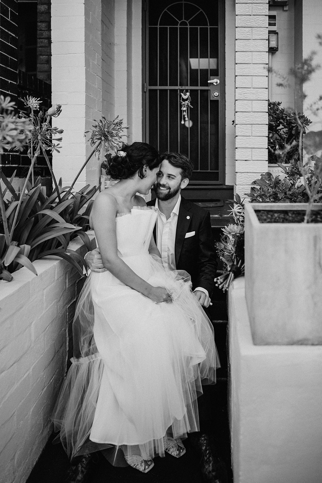 bride and groom portrait on stairs of terrace house