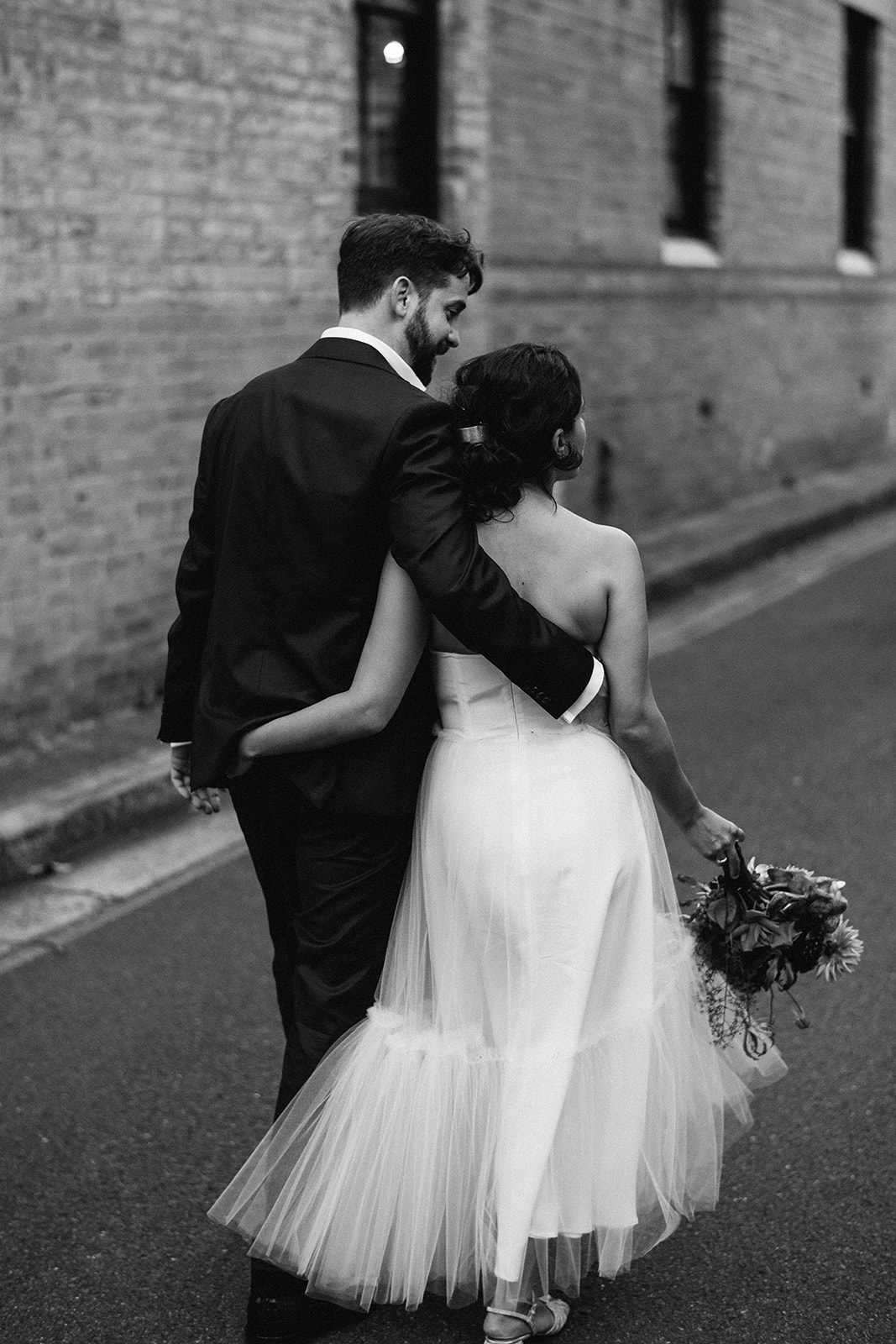 Scott Surplice bride and groom walk with arms around each other