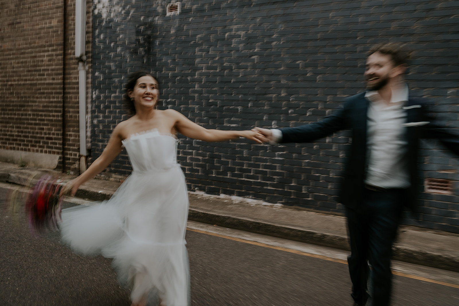 Scott Surplice portrait of groom spinning bride around motion blur